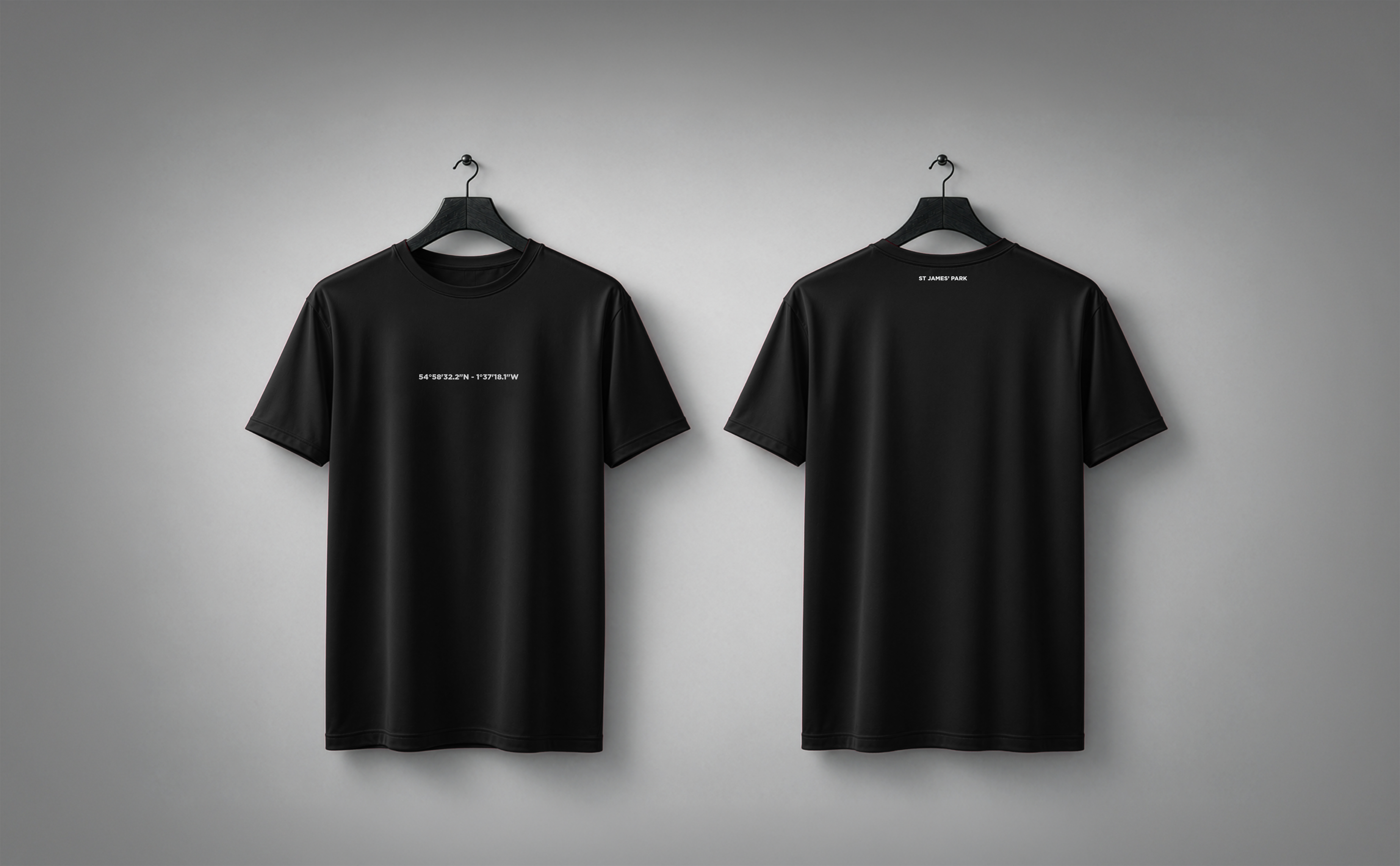 Black STADIA T-shirt shown from the front and back, carrying the coordinates and name of St.James' Park.